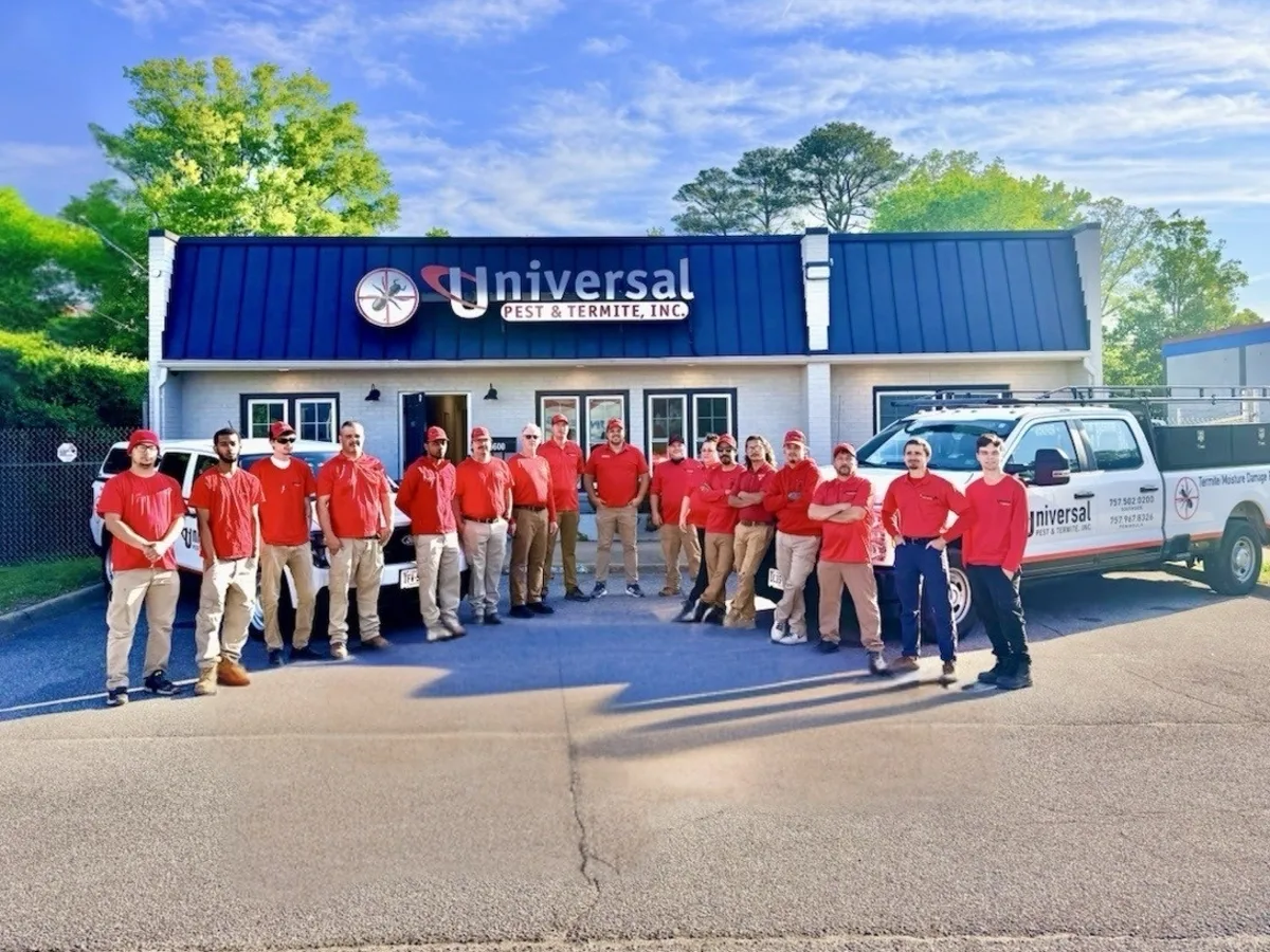 Universal technicians in red shirts and their service trucks at the company home office, serving Hampton Roads homeowners
