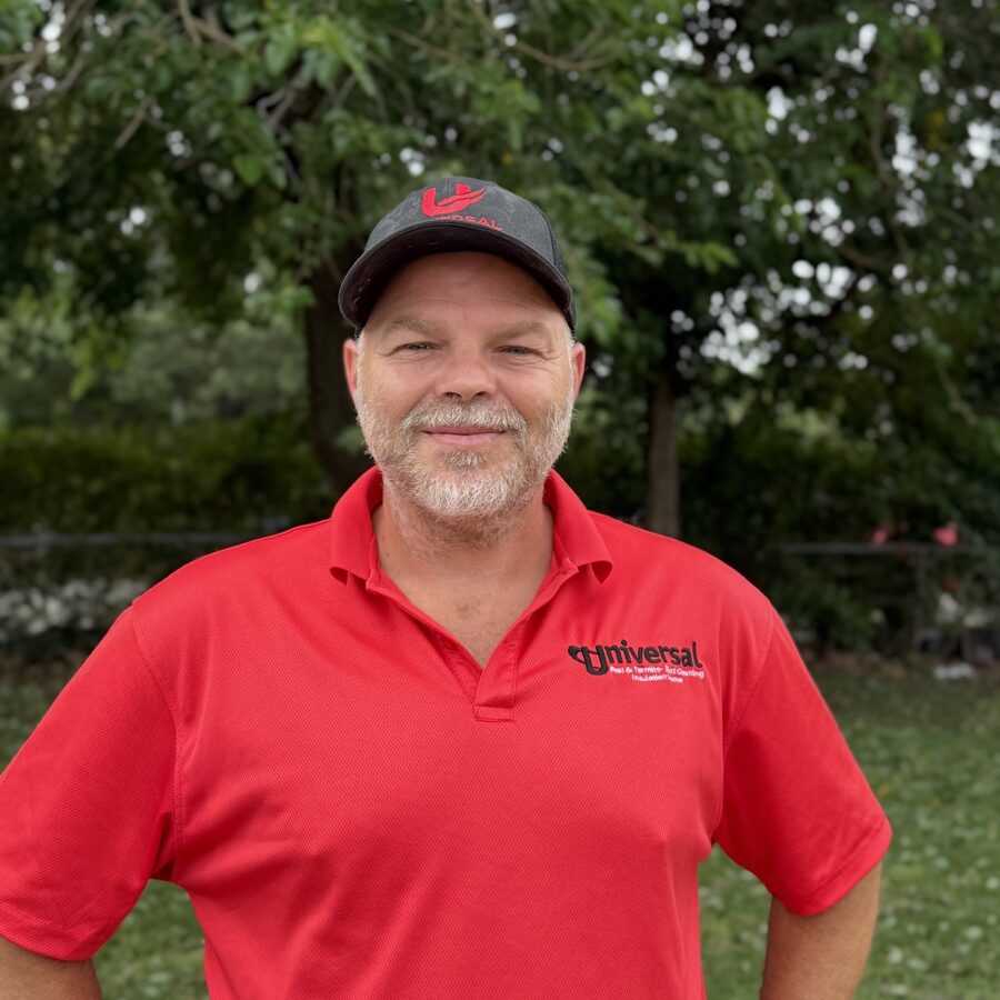 Jacob, Universal Duct Cleaning lead technician, wearing a red Universal-branded polo shirt and cap